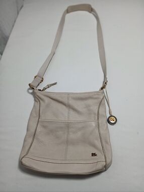 The Sak Cream Leather Crossbody Bag with Gold Charm